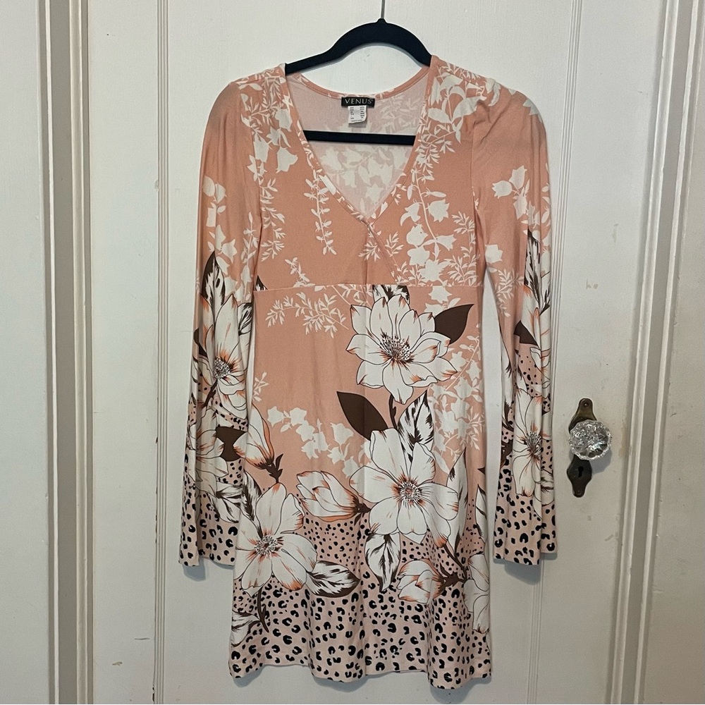 Women’s long bell-sleeved midi dress. Mixed pattern. Size XS. New. Never worn.